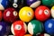 Many colorful billiard balls as background, top view