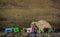 Many colorful christmas presents on wooden old background.