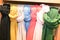 Many colorful clothes rack with selection of scarves scarfs shop