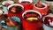 Many colorful cups with mulled wine on festive table