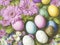 Many colorful Easter eggs in a stack with various pastel colors in the spring season in a bright flora colored style