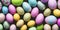 Many colorful Easter eggs in a stack with various pastel colors in the spring season in a bright flora colored style