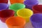 Many colorful empty paper forms capsules for muffins and cupcakes on white background - baking dessert - close up on white