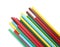 Many colorful glue sticks on white background, top view