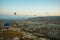 Many colorful hot air balloons flight above mountains - panorama of Cappadocia at sunrise. Wide landscape of Goreme valley