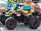 Many colorful motor buggy with helmets