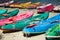 Many colorful old Canoes Kayaks on the beach at Nang Rum Beach, Sattahip, Chonburi, Thailand