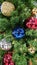 Many colorful ornaments on Christmas tree.