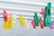 many colorful pins hang on the clothes dryer in laundry