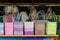 Many colorful plastic baskets in shop sheds