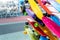 Many colorful plastic small skateboards toys hanged on store shop window display. Child sport and fun accessories. Children gift