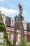 Many colour birdhouses hanging tree on the building facade background