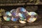 the many copies of trash and dirty compact disc in the drain