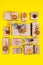 Many craft gift boxes on yellow background. Christmas holiday package above. New year knolling flat lay still lfe