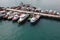 Many cutters at its mooring in port.