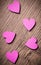 Many decoration hearts on wooden background