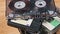 Many Different Audio Cassettes Rotates on a Wooden Table Close-Up
