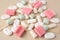 Many different chewing gums on beige background, closeup