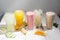 Many different cocktails and milkshakes on a light background.