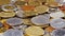 Many different coins collection background rotating