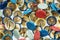 Many different colorful thumbtacks, colorful background