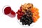 Many different dried fruits dried apricots, apples, pears, prunes on a white plate and a glass of compote