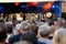 Many different people listen to a rock band The Queen Kings at an open-air concert. Neckarsulm, Germany - August 8, 2019