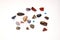 Many different stones and gems on white background