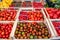 Many different tomato varieties heap on market stall