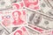 Many dollars, Money american and Chinese yuan banknotes, background. concept finance global economy.