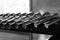 Many dumbbells for fitness, close-up, black white photo