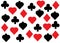 Many duplicates of the four suites of a deck of poker playing cards - spade, heart, diamond and club