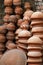 Many earthen pots or clay pots are kept for drying in the sun in the workshop