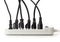 Many electrical cords connected to a power strip