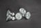 : Many electrical small bulbs, lights, on dark grey background