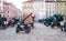 Many empty prams parked on city street