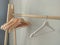 Many empty wooden clothes hangers on the rack Store concept, sale, design, empty hangers.