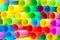 Many ends of multicoloured plastic drinking straws
