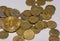 many euro coins and one golden valuable bitcoin in the middle left