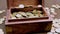 Many euro coins in wooden box on white save money