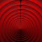 many evenly spaced concentric circles in vivid red and black travelling at speed towards a vanishing point