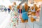 Many fashion mannequins street front shop with dress and swimwear