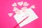 Many felt forms of heart in the letter on the pink background