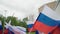 many flags of Russia flutter in the wind
