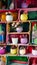 Many flowers in pots on wooden shelves lined up as decor