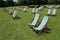 Many folding chairs in Hyde Park in the city London.