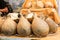 Many forms of caciocavallo cheese sale in Italian market.