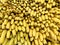 Many fresh fruits yellow bananas in supermarket, food concept