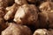 Many fresh Jerusalem artichokes as background, closeup