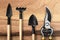 Many gardening tools on wooden background